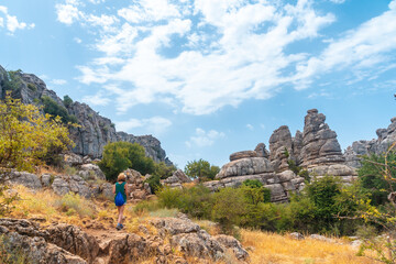 A young woman enjoying the Torcal de Antequera on the green and yellow trail, Malaga. Andalusia