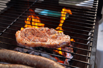 Lamb chop on a grill. South African braai with meat on the grill. Tjops. Braai day. 