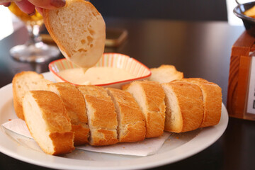 roasted bread with garlic aioli sauce closeup photo on table background