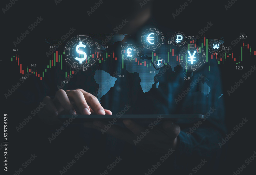 Wall mural Global currency exchange and money transfer concept, Businessman using tablet with world map and currency sign include dollar yuan yen euro and pound sterling.