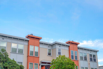 Apartment building with beige, gray, and orange exterior in San Francisco, California