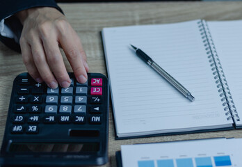 Business woman working on Desk office in finance and accounting Analyze financial budget in the office