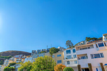 Low angle view of residential buildings near the mountain at the back in San Francisco, CA