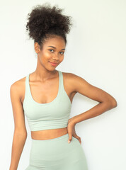 Portrait of happy beautiful afro hair woman smiling face. Cheerful attractive multiracial friendly girl model with curly hair confidently smile while standing isolated on white background. copy space.