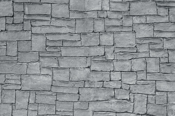 grey concrete stone wall background with various shapes