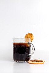a glass of cola with ice, dried fruit
