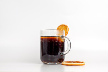 a glass of cola with ice, dried fruit