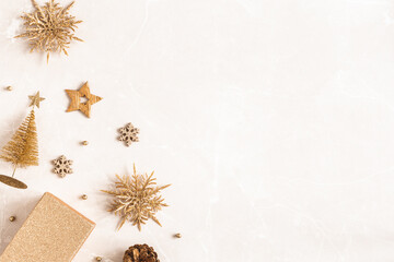 Christmas composition. Golden decorations on marble beige background. Christmas, winter, new year concept. Flat lay, top view, copy space - 529806152