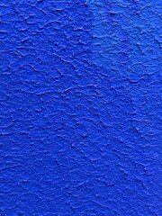 Vertical closeup shot of a blue popcorn ceiling surface