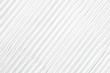 Fabric background made of tulle, a transparent mesh fabric in white with a minimalist stripe pattern