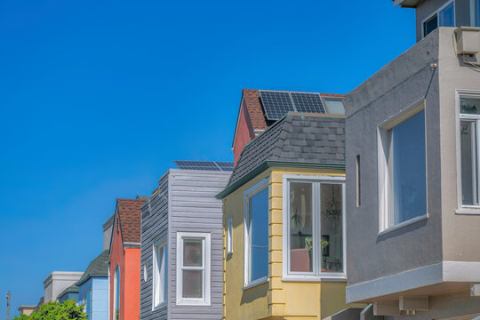 Side view of suburban houses with clear glass window panes in San Francisco, California
