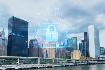 New York City skyline, United Nation headquarters over the East River, Manhattan, Midtown at day time, NYC, USA. The concept of cyber security to protect confidential information, padlock hologram