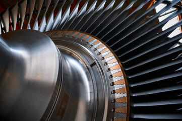 The rotor blades of a modern turbine, a close-up shot of the roots of long blades