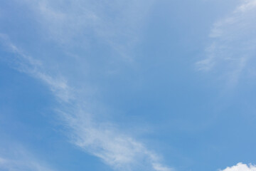 The blue sky and white clouds float in the sky on a clear day with warm sunlight. combined with the cool breeze blowing into the body This results in a wonderfully heavenly freshness.