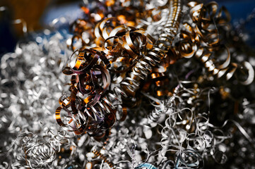 Pile of metal shavings on floor in workshop macro view