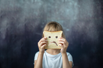 Diet celiac. gluten free bread in the hands of a child. Celiac world day. 