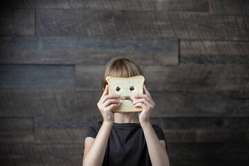diet celiac. gluten free bread in the hands of a child