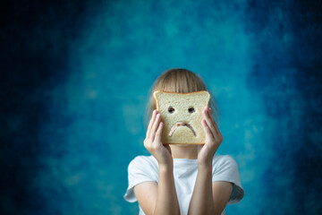Children gluten free intolerance. Allergy for wheat. gluten free bread in the hands of a child