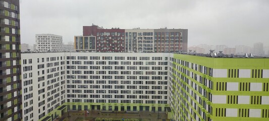 colored apartment buildings in the fog