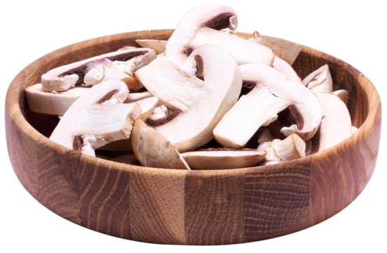 Sliced white champignon mushrooms in wooden bowl isolated
