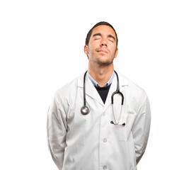 Stressed doctor against white background