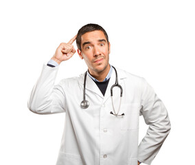 Fototapeta premium Puzzled doctor against white background