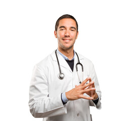 Happy doctor with a concentration gesture