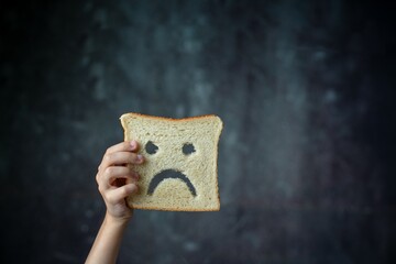 Banner. Cover. diet celiac gluten free intolerance.  sad bread on the child hands. Gluten free food.
