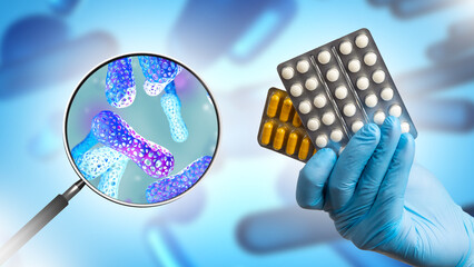 Pharmaceutical probiotics. Beneficial bacteria under magnifying glass. Pharmaceutical probiotics in...