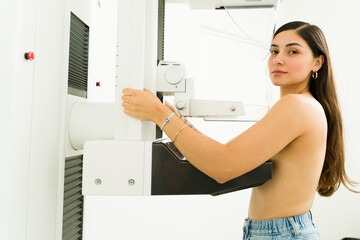 Fototapeta na wymiar Beautiful woman in her 20s doing a mammogram test to check for breast cancer