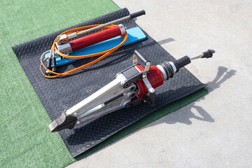 Hydraulic rescue equipment. Equipment for rescue operations. Hydraulic spreader lies on ground....
