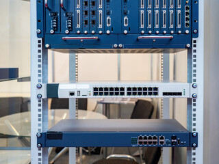 Optical multiplexer. Network hardware. Internet switch. Internet equipment on metal frame. Rack for...