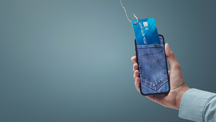 Hacker stealing credit card information on a smartphone