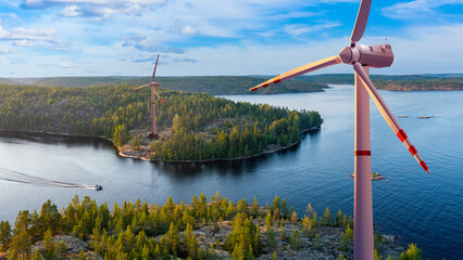 Wind generators over river. Windmills view from quadcopter. Several wind generators in summer...