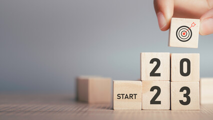 Start 2023 concept, 2023 years Target successful in wood cube for beginning new year for planning. background for the happy new years for text with copy space.