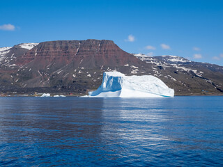 Giant icebergs just off the city of Qeqertarsuaq, Disko Island,  Disko Bay, Western Greenland