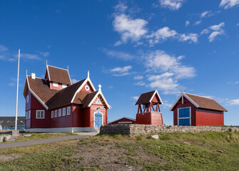 Fototapeta na wymiar The charming town of Qeqertarsuaq (formerly Godhavn) on the south coast of Disko Island, Western Greenland.