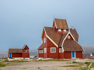 The charming church of Qeqertarsuaq (formerly Godhavn) on the south coast of Disko Island, Western Greenland. © Luis
