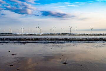 Bunch of wind turbines on a wind farm near the water in Redcar, England