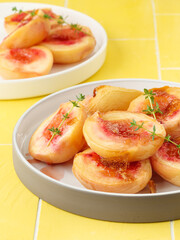 Baked peaches with fresh thyme.