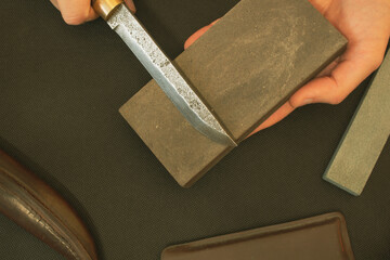 manual sharpening of a knife from high-carbon steel, Damascus Blade