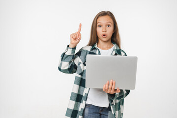 Naklejka premium Intelligent caucasian young preteen teenage girl schoolgirl using laptop for social media, online e-learning e-commerce having idea isolated in white background