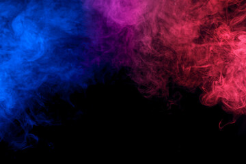 Smoke in red-blue light on black background in darkness