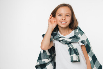 Closeup cropped small caucasian preteen teenage girl schoolgirl in shirt overhearing eavesdrop...