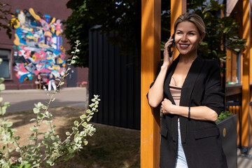 woman self-employed person talking on the phone in the city