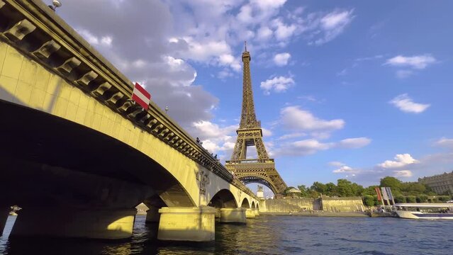 Eiffel Tower with artesian well, water gush in summer holiday, Paris city in sunny day