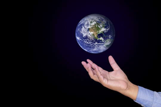 Conceptual enviromental earth above hand, Earth of this image from NASA 