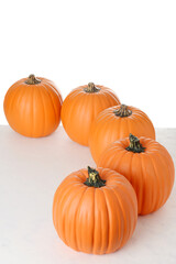 top view fake pumpkins in a row