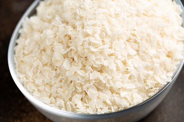 Gluten free Rice flake porridge in a glass bowl