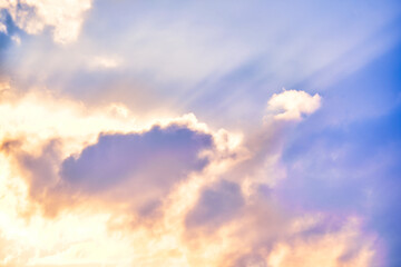 Bright rays of the sun through the dramatic clouds